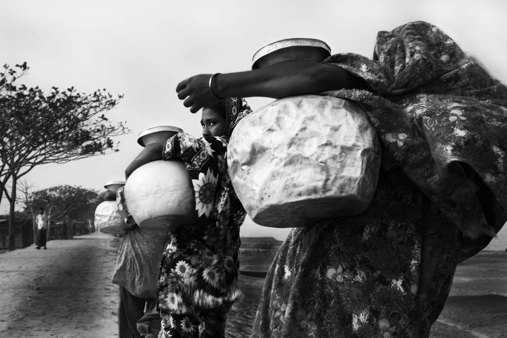 Women Carrying Water Pitchers