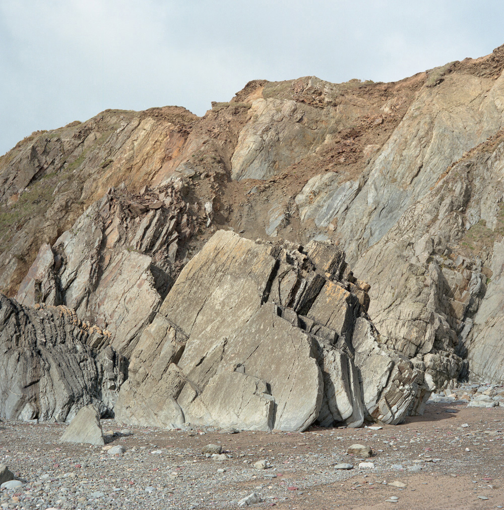The surrounding cliffs at Marloes Sands are layered with red sandstone and grey shale. Evidence of life dating as far back as 439 million years ago can be seen on various rocks featuring prehistoric marks. The Marloes Peninsula 7 miles (11 km) west of the port of Milford Haven and forms the westernmost tip of the southern shore of St Brides Bay.