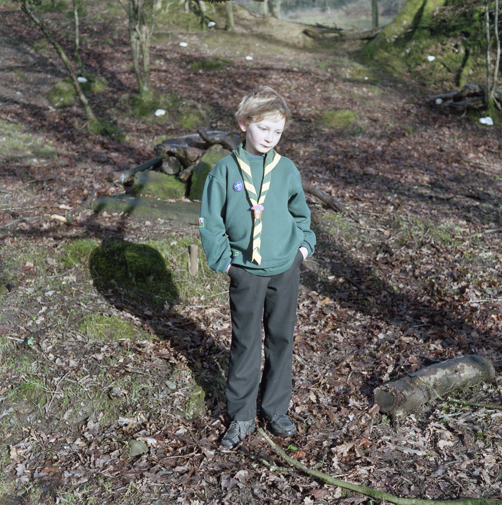 Cub Scouts are young people aged between 8 and 101Ú2 year old. Easily recognized by their distinctive dark green sweatshirt and Group scarf. Here Zach aged 10 and a member of the Carmarthenshire scouts stands in a woodland area nearLaugharne south of the landsker line.